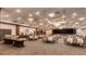 Spacious event hall featuring tables, chairs, buffet area, and chandeliers at 22725 E Long Dr, Aurora, CO 80016