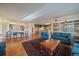 Spacious living room featuring hardwood floors, arched doorways, and large windows at 22725 E Long Dr, Aurora, CO 80016