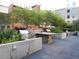 Outdoor grilling area with multiple grills and seating at 1625 Larimer St # 1001, Denver, CO 80202