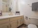 Bright bathroom featuring a white vanity, gold hardware, and a shower with white tile at 1625 Larimer St # 1001, Denver, CO 80202