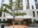 The Barclay's elegant building entrance features a covered awning and landscaped planters, offering a sophisticated welcome at 1625 Larimer St # 1001, Denver, CO 80202