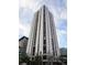 Striking building exterior showcasing modern architecture against a clear blue sky, highlighting its impressive height at 1625 Larimer St # 1001, Denver, CO 80202