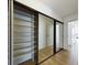 Well-organized closet with mirrored sliding doors and shelving at 1625 Larimer St # 1001, Denver, CO 80202