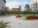 Beautiful outdoor courtyard with manicured garden beds, mature trees, and comfortable seating areas, offering a relaxing space at 1625 Larimer St # 1001, Denver, CO 80202