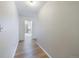 Well-lit hallway with wood-look floors, leading to the kitchen, offering a seamless flow throughout the home at 1625 Larimer St # 1001, Denver, CO 80202