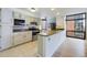 Well-lit kitchen boasts stainless steel appliances, granite countertops, and city views through large windows at 1625 Larimer St # 1001, Denver, CO 80202