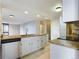 Open kitchen featuring granite countertops, stainless steel dishwasher, and bright lighting at 1625 Larimer St # 1001, Denver, CO 80202