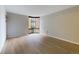 Bright living room featuring light hardwood floors and a large window at 1625 Larimer St # 1001, Denver, CO 80202