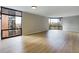 Bright living room featuring hardwood floors, large windows, and city views at 1625 Larimer St # 1001, Denver, CO 80202