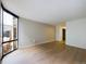 Spacious living room with wood floors and a large window at 1625 Larimer St # 1001, Denver, CO 80202