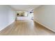 Open living area with view into kitchen and hardwood floors at 1625 Larimer St # 1001, Denver, CO 80202