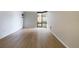 Bright living room featuring light hardwood floors and a large window at 1625 Larimer St # 1001, Denver, CO 80202