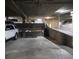 Well-lit parking garage featuring concrete supports, clearly marked exit signs, and parking for residents' vehicles at 1625 Larimer St # 1001, Denver, CO 80202