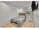 Cozy bedroom featuring carpet flooring, tv, and neutral colored walls at 16403 E Radcliff Pl # A, Aurora, CO 80015