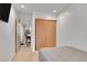 This bedroom features neutral paint colors, a closet, and access to the dining room at 16403 E Radcliff Pl # A, Aurora, CO 80015