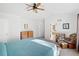 Main bedroom with ensuite bathroom and ceiling fan at 21792 Silver Meadow Ln, Parker, CO 80138