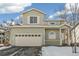 Two-story house with attached garage and snowy front yard at 21792 Silver Meadow Ln, Parker, CO 80138