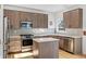 Updated kitchen featuring stainless steel appliances and an island at 21792 Silver Meadow Ln, Parker, CO 80138