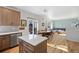 Open concept kitchen with island, flows into living room at 21792 Silver Meadow Ln, Parker, CO 80138