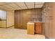 Basement featuring carpet, storage, and a utility sink with mini fridge at 3561 Kalispell St, Aurora, CO 80011