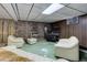 Cozy finished basement with a stone fireplace and comfortable seating for relaxation at 3561 Kalispell St, Aurora, CO 80011
