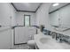 Bathroom with stylish tile accents, sleek fixtures, and a modern walk-in tub at 3561 Kalispell St, Aurora, CO 80011