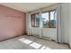Bedroom featuring carpet, natural light from large windows, and a glass shelf at 3561 Kalispell St, Aurora, CO 80011