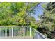 Deck overlooking a beautiful lawn and mature trees, perfect for outdoor enjoyment and relaxation in a serene environment at 3561 Kalispell St, Aurora, CO 80011