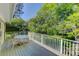 Inviting deck with a table and chairs, providing a lovely view of the well-maintained backyard and surrounding greenery at 3561 Kalispell St, Aurora, CO 80011