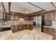 Spacious kitchen features stainless steel appliances and ample cabinet space at 3561 Kalispell St, Aurora, CO 80011