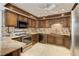 Well-equipped kitchen with stainless steel appliances and granite countertops at 3561 Kalispell St, Aurora, CO 80011