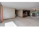 Open-concept living room featuring a partial kitchen view and access to the dining area at 3561 Kalispell St, Aurora, CO 80011