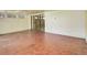 Spacious living room with sliding glass door to backyard and tile flooring throughout at 3561 Kalispell St, Aurora, CO 80011