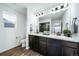 Bathroom with double vanity and walk-in shower at 5385 Walden Ct, Denver, CO 80249