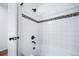 Modern bathroom with a bathtub and tiled shower surround at 5385 Walden Ct, Denver, CO 80249