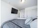 Serene bedroom with a wall-mounted TV and large closet at 5385 Walden Ct, Denver, CO 80249