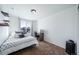 Well-lit bedroom with a desk and window views at 5385 Walden Ct, Denver, CO 80249