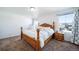 Bright bedroom featuring a king-size bed and nightstand at 5385 Walden Ct, Denver, CO 80249