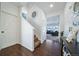 Staircase and entryway with hardwood floors and white walls at 5385 Walden Ct, Denver, CO 80249