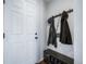 Neat entryway with bench, storage, and coat hooks at 5385 Walden Ct, Denver, CO 80249