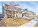 Row of two-story houses with similar design and landscaping at 5385 Walden Ct, Denver, CO 80249