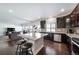 Kitchen with dark cabinets, granite countertops, and stainless steel appliances at 5385 Walden Ct, Denver, CO 80249