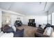 Bright living room with comfortable seating and a view into the kitchen at 5385 Walden Ct, Denver, CO 80249