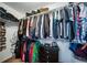 Spacious walk-in closet with ample shelving and hanging space at 5385 Walden Ct, Denver, CO 80249