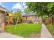 Back yard featuring a lush green lawn and mature trees at 3334 W 37Th Ave, Denver, CO 80211