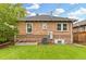 Backyard with lawn and brick exterior at 3334 W 37Th Ave, Denver, CO 80211