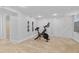 Basement workout area with exercise bike, neutral carpet, white walls and sliding door closet at 3334 W 37Th Ave, Denver, CO 80211