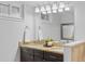 Bathroom with double granite vanity, tiled bath, modern lighting and fixtures at 3334 W 37Th Ave, Denver, CO 80211
