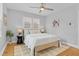 Serene bedroom with a comfy bed, ceiling fan, and natural light from two windows at 3334 W 37Th Ave, Denver, CO 80211