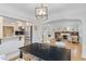 Open floor plan showcasing the dining room with an archway view to living room and kitchen at 3334 W 37Th Ave, Denver, CO 80211